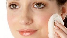 woman applying facial toner