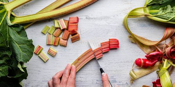 chopping rhubarb into chunks