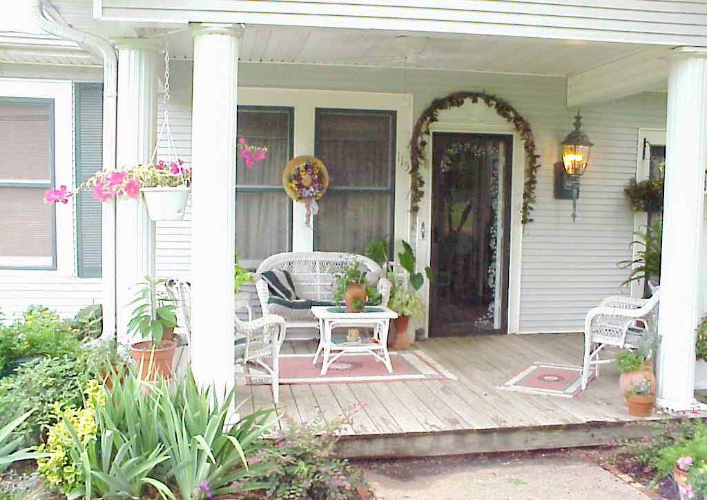 porch and entry with flowers and greenery