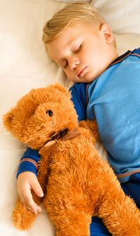 toddler asleep with teddy